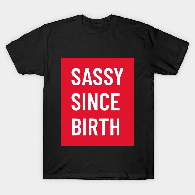 Funny bold white ‘SASSY SINCE BIRTH’ text with a red background T-Shirt by keeplooping